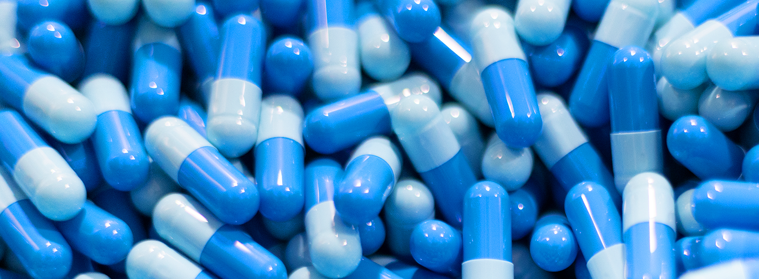 A close up of blue capsules